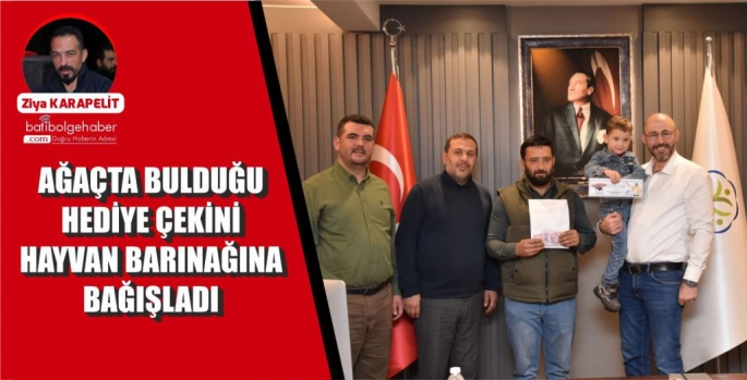 AĞAÇTA BULDUĞU HEDİYE ÇEKİNİ HAYVAN BARINAĞINA BAĞIŞLADI